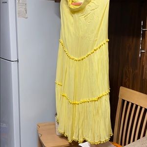 Yellow pom pom skirt